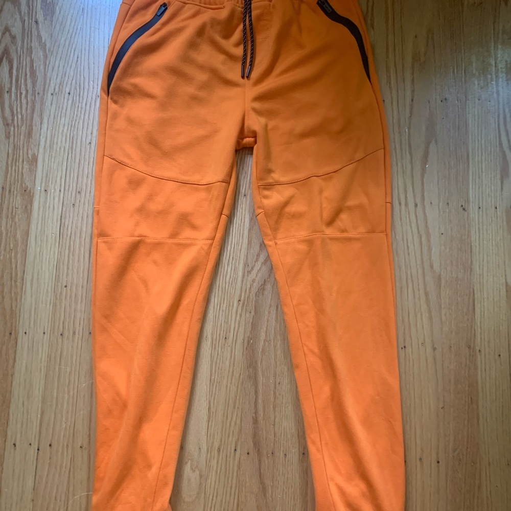 Orange sweatpants for sale.